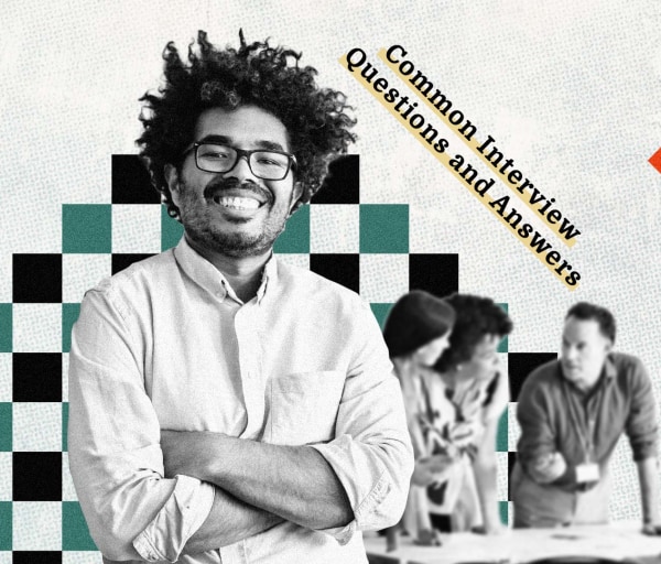 a man with curly hair and glasses smiling with a group of people delegating in the background